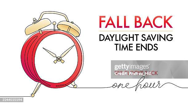 fall back daylight saving time reminder message with alarm clock - fall back stock illustrations