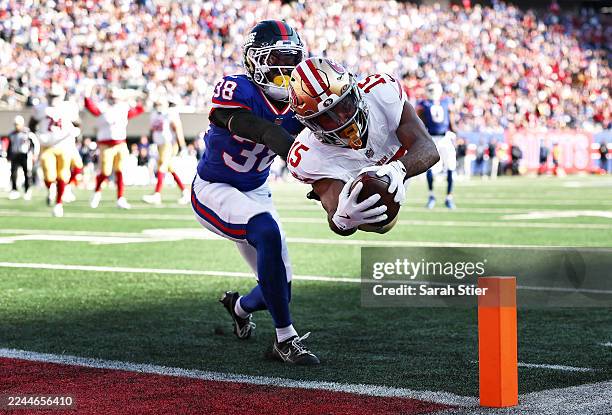 Jauan Jennings of the San Francisco 49ers scores a touchdown against Korie Black of the New York Giants during the second quarter in the game at...