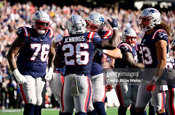 Terrell Jennings of the New England Patriots celebrates a touchdown with teammates against the Atlanta Falcons during the second quarter in the game...