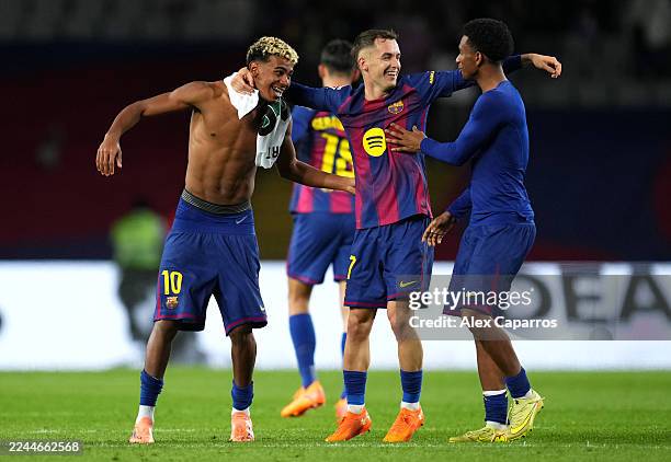 Lamine Yamal, Marc Casado and Alejandro Balde of FC Barcelona celebrate victory following the LaLiga EA Sports match between FC Barcelona and Elche...