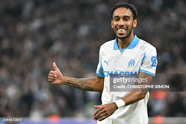 Marseille's Gabonese forward Pierre-Emerick Aubameyang gestures during the UEFA Champions League, league phase day 4, football match between...