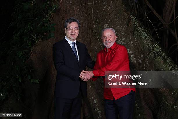 President of Brazil Luiz Inacio Lula da Silva shakes hands with the Vice Premier of the State Council of the People's Republic of China Ding Xuexiang...