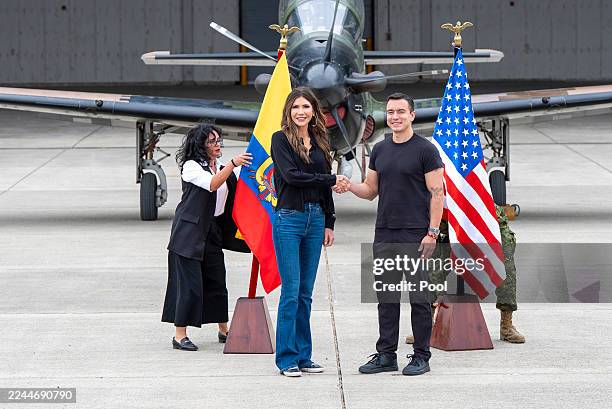 Homeland Security Secretary Kristi Noem shakes hands with Ecuador's President Daniel Noboa during a tour of Eloy Alfaro Air Base on November 5, 2025...