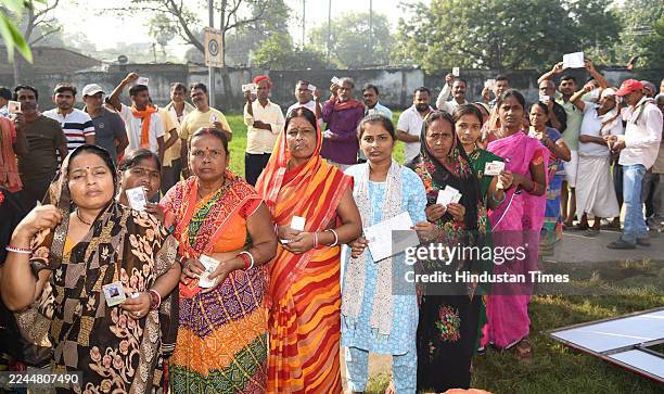 Voters standing in queue for cast their votes during Bihar Assembly Elections 2025 at a polling booth at Danapur on November 6, 2025 in Patna, India....