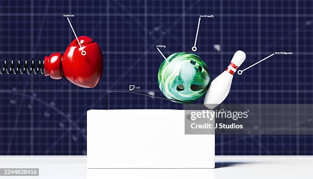 data-driven strategy concept - rube goldberg contraption with boxing glove and bowling pin - domino effect stock pictures, royalty-free photos & images