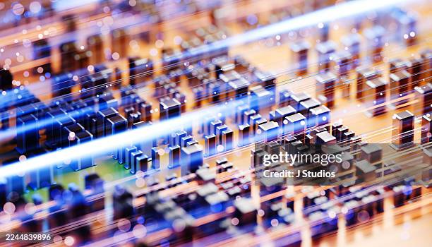 close-up of motherboard with resistors and flowing light data streams representing machine learning - quantum computing stock pictures, royalty-free photos & images