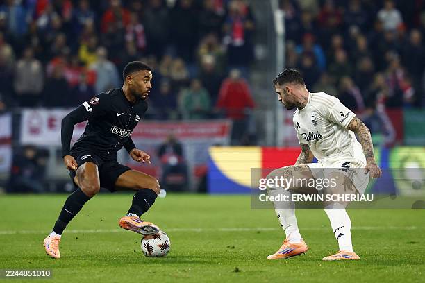 Sturm Graz's German forward Maurice Malone and Nottingham Forest's Brazilian defender Morato vie for the ball during the UEFA Europa League football...