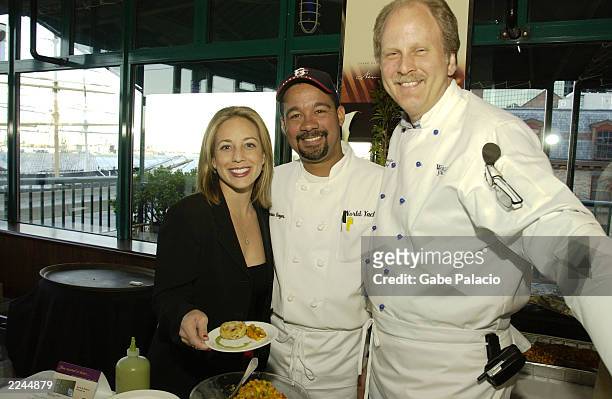 Lauren Glassberg, reporter with WABC-TV, helps out Damian Reyes, Executive Sous Chef, and Patrick Augustyn, Executive Chef, from World Yacht. 2002...