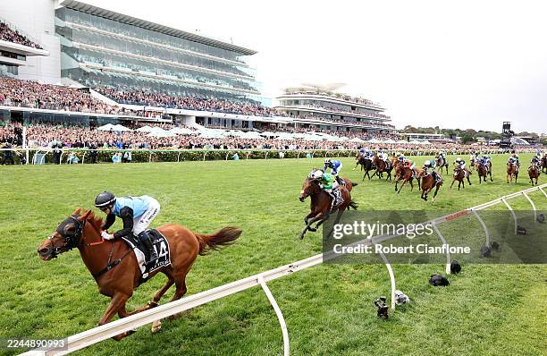 Jamie Melham rides Half Yours to win race seven the Lexus Melbourne Cup during Melbourne Cup Day at Flemington Racecourse on November 04, 2025 in...
