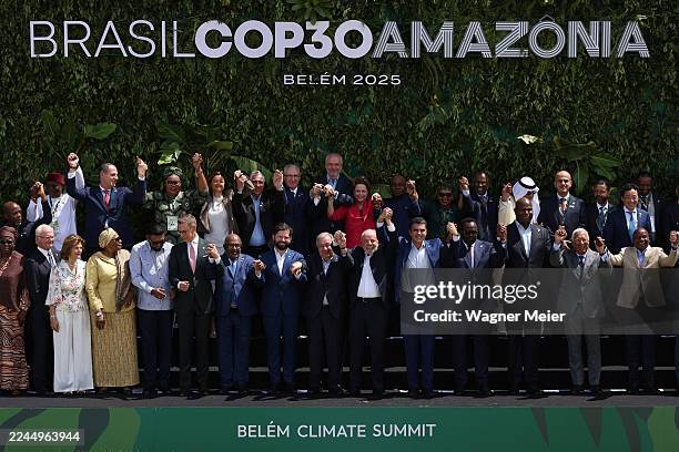 President of Brazil Luiz Inacio Lula da Silva , UN General Secretary Antonio Guterres and Leaders pose for the family photo holding hands during the...