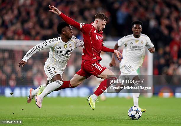 Conor Bradley of Liverpool is fouled by Vinicius Junior of Real Madrid which resulted in a yellow card during the UEFA Champions League 2025/26...