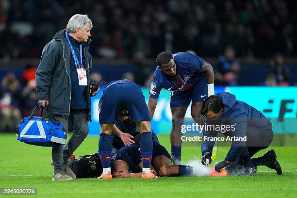 Achraf Hakimi of Paris Saint-Germain receives medical treatment during the UEFA Champions League 2025/26 League Phase MD4 match between Paris...