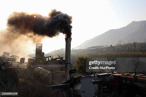 Chimney at a macadam plant emits smoke, causing air pollution on the outskirts of Baramulla, Jammu and Kashmir, India, on November 8, 2025 .