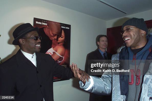 Actor Wesley Snipes and rapper LL Cool J greet each other at the ...