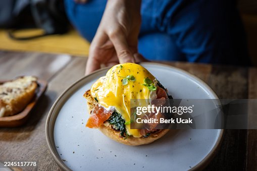 Eggs Benedict is serving on breakfast table. Eggs Benedict is serving on breakfast table.