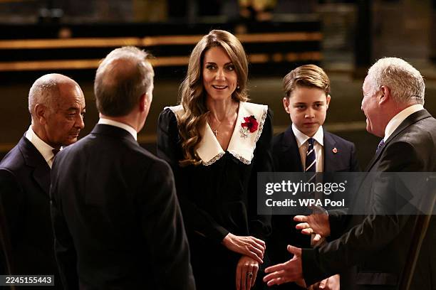 Britain's Catherine, Princess of Wales, and Prince George arrive at the Royal Albert Hall for the Royal British Legion Festival of Remembrance, an...