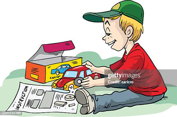 a child is assembling a toy car. - model car stock illustrations