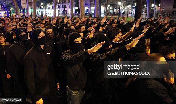 Members of Spanish neonazi group Nucleo Nacional give a Nazi salute during a demonstration called to protest 'against the corrupt politicians' in...