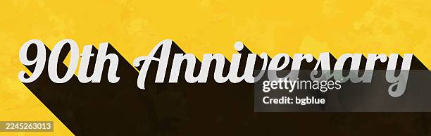 90th anniversary - text with long shadow on textured yellow background - number 90 stock illustrations
