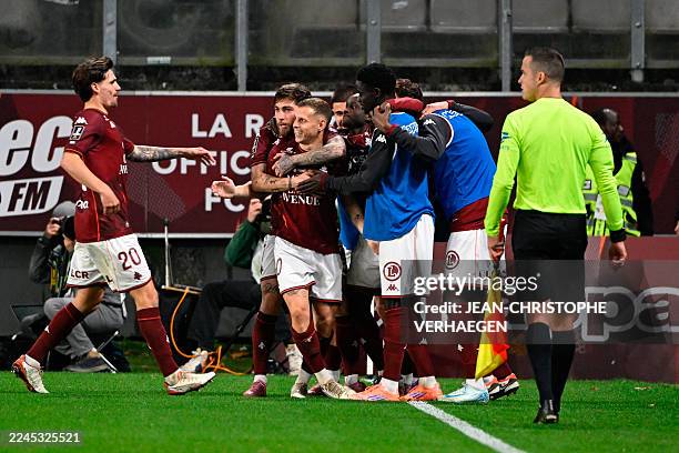 Metz's French midfielder Gauthier Hein celebrates scoring his team's first goal during the French L1 football match between FC Metz and OGC Nice at...