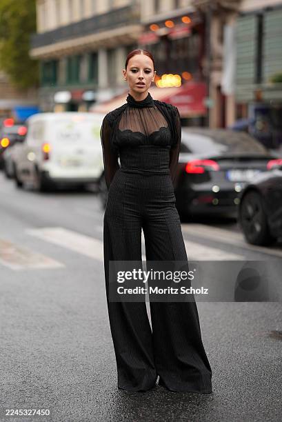 Marie Gaguech is seen wearing full Nina Ricci look; a sheer high-neck blouse with delicate pleating and puffed sleeves; a structured pinstripes...