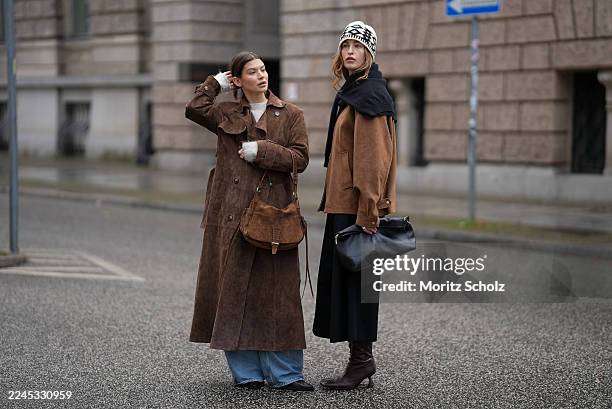 Sina Anjulie is seen wearing a light brown suede jacket with a front zip fastening by Dunst; a black wool sweater draped over the shoulders by COS; a...