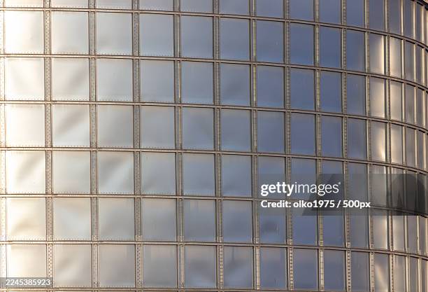 full frame abstract of a patterned metallic wall with reflections,ukraine - full elevator stock pictures, royalty-free photos & images