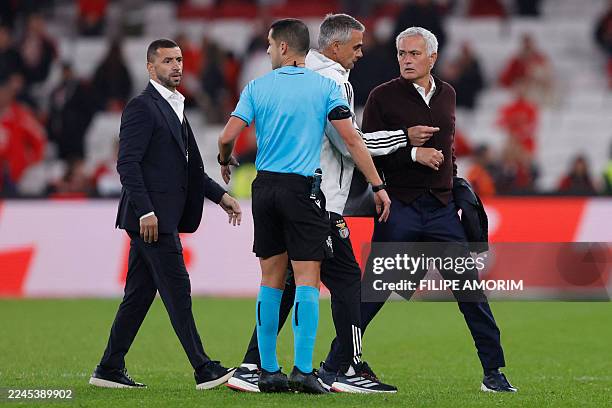 Benfica's Portuguese head coach Jose Mourinho speaks with Portuguese referee Gustavo Correia at the end of the Portuguese league football match...
