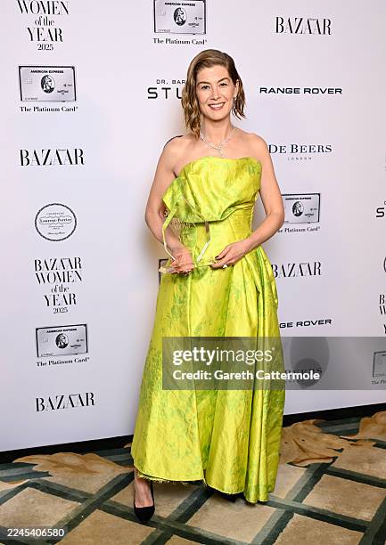 Rosamund Pike, winner of Theatre Actress of The Year Award, poses in the Winner's Room during Harper's Bazaar Women Of The Year at Claridges Hotel on...