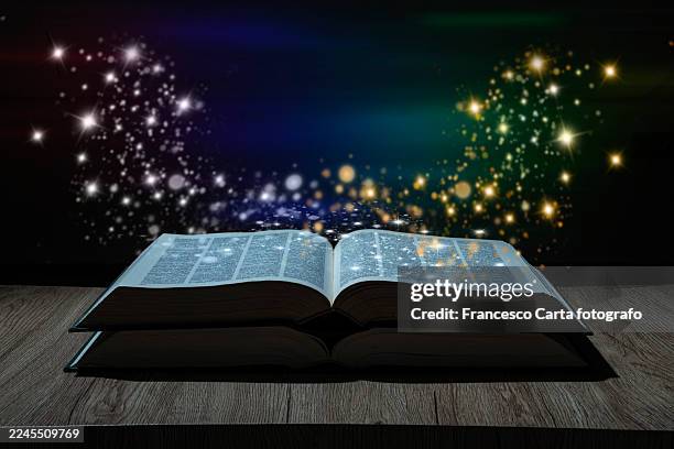 bewitched book with magic glows - fairytale stock pictures, royalty-free photos & images