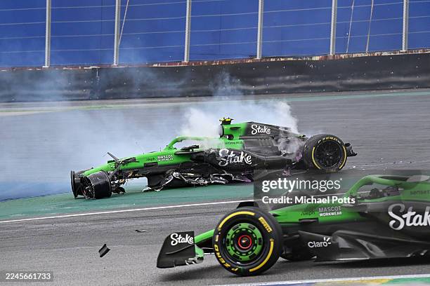 Gabriel Bortoleto of Brazil driving the Kick Sauber C45 Ferrari crashes out as Nico Hulkenberg of Germany driving the Kick Sauber C45 Ferrari passes...