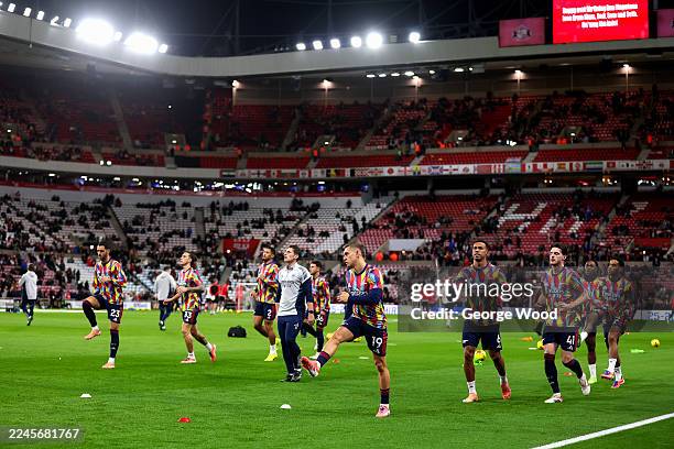 Players of Arsenal warm up prior to the Premier League match between Sunderland and Arsenal at the Stadium of Light on November 08, 2025 in...
