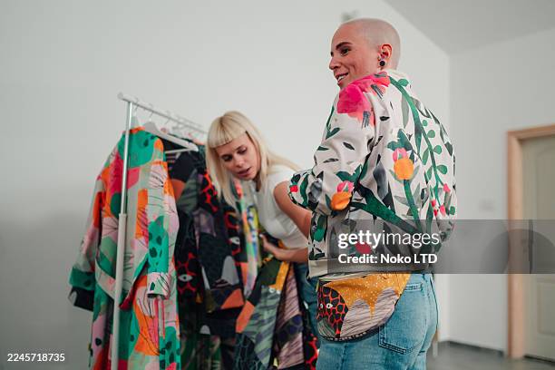 women shopping for vibrant unique fashion clothing - creative director stock pictures, royalty-free photos & images