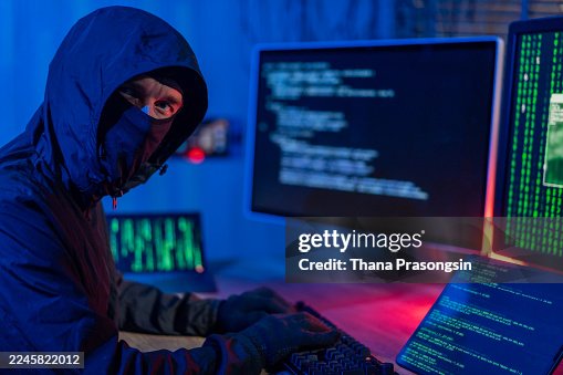 Computer hacker doing coding on computer while sitting at Home Garage Computer hacker doing coding on computer while sitting at Home Garage