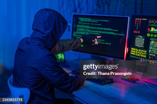 Computer hacker doing coding on computer while sitting at Home Garage Computer hacker doing coding on computer while sitting at Home Garage