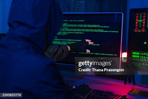 Computer hacker doing coding on computer while sitting at Home Garage Computer hacker doing coding on computer while sitting at Home Garage