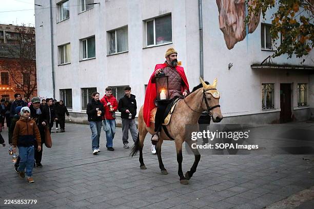 Children with lanterns and an actor on horseback portraying St. Martin near St. Paul's Lutheran Church. St. Martin's Eve was held at St. Paul's...