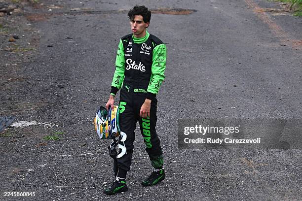 Gabriel Bortoleto of Brazil and Stake F1 Team Kick Sauber watches from the sidelines after a crash during the F1 Grand Prix of Brazil at Autodromo...