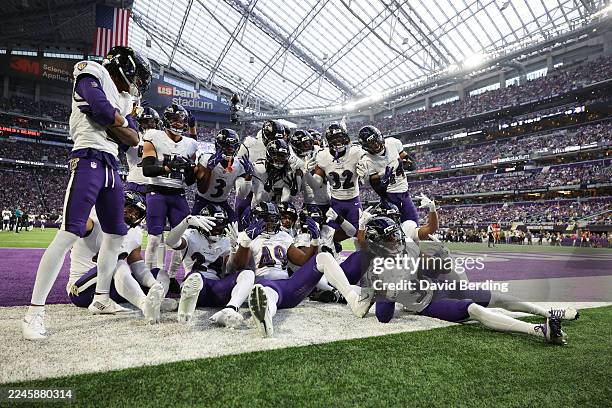 The Baltimore Ravens celebrate a fumble recovery by Keondre Jackson against the Minnesota Vikings during the third quarter in the game at U.S. Bank...