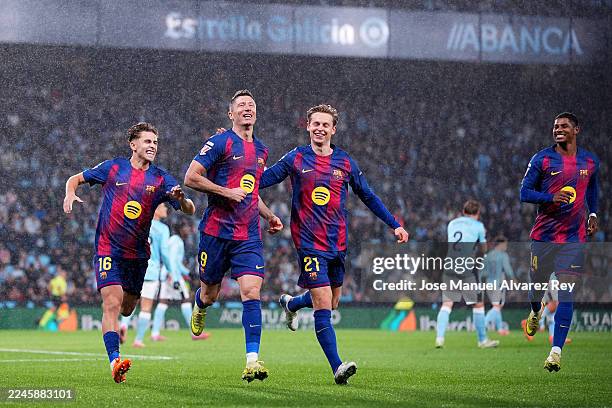 Robert Lewandowski of FC Barcelona celebrates scoring his team's first goal with teammates during the LaLiga EA Sports match between RC Celta de Vigo...