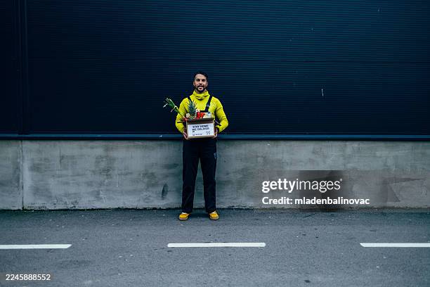 delivery man holding fresh groceries food box - contactless delivery stock pictures, royalty-free photos & images