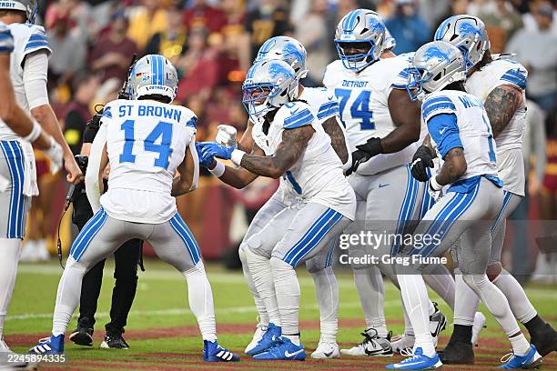 Jahmyr Gibbs of the Detroit Lions celebrates after his receiving touchdown against the Washington Commanders in the first quarter of a game at...