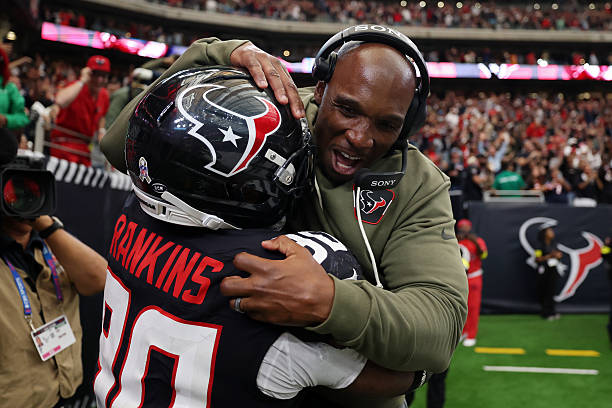 Head coach DeMeco Ryans and Sheldon Rankins of the Houston Texans celebrate their 36-29 win against the Jacksonville Jaguars in the game at NRG...