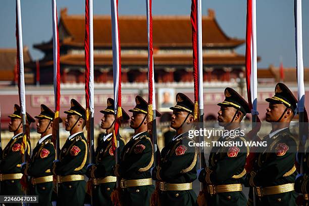 Honour guards line up before a welcoming ceremony for Thailand's King Maha Vajiralongkorn and Queen Suthida at the Great Hall of the People in...