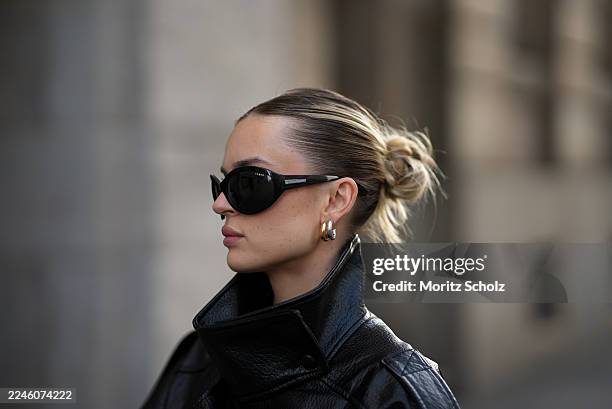 Duesseldorf, GERMANY Romina Meier is seen wearing an oversized black viral leather PU jacket with a funnel neck collar, wide oversized silhouette and...