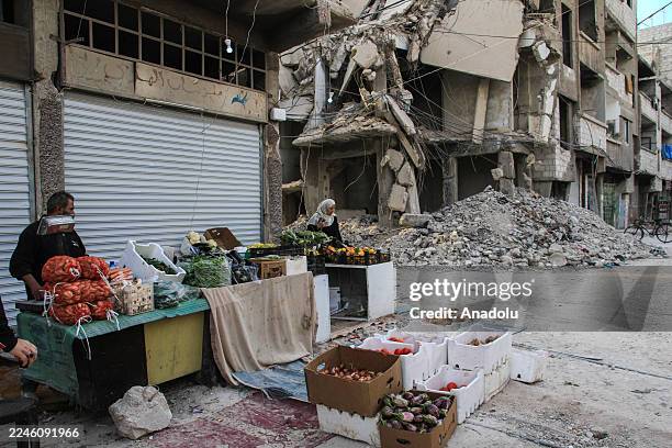 Street vendor is seen in the Yarmouk Camp which suffered severe destruction during the war, as life begins to revive with the return of thousands of...