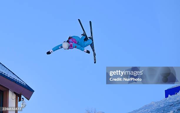Member of the national freestyle skiing aerials training team attempts a jump during training in Xing'an League, Inner Mongolia, China, on November...