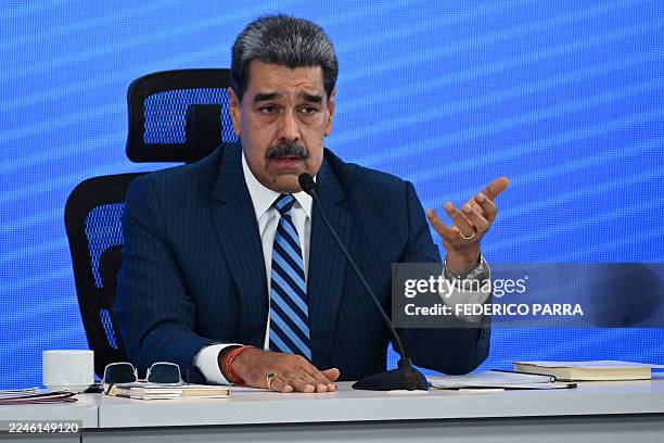 Venezuela's President Nicolas Maduro speaks during the Meeting of Jurists in Defense of International Law at the Eurobuilding Hotel in Caracas on...
