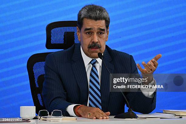 Venezuela's President Nicolas Maduro speaks during the Meeting of Jurists in Defense of International Law at the Eurobuilding Hotel in Caracas on...