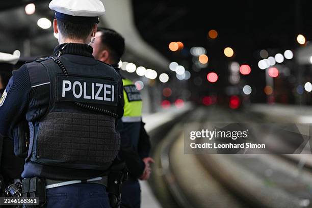 Police officers are seen patrolling the station as German Interior Minister Alexander Dobrindt and Munich Federal Police Vice President Franz-Xaver...